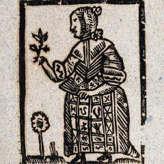 woodcut of witch holding plant in one hand and fan in other; Image by Wellcome Images, CC BY 4.0, via Wikimedia Commons