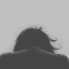 grieving woman, head down, black and white; Image via Pixabay, CC0 Public Domain 